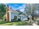 View of the home highlighting the blue siding and covered porch at 311 W Center Ave, Mooresville, NC 28115