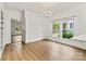 Spacious living room with large windows, plenty of light, and luxury vinyl flooring at 311 W Center Ave, Mooresville, NC 28115