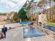Outdoor dining area on a deck with seating, an outdoor kitchen and beautiful backyard at 3911 Granite St, Terrell, NC 28682