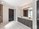 Large bathroom with double sink vanity and private toilet room with tile shower and tub at 3911 Granite St, Terrell, NC 28682