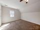 Spacious bedroom with neutral carpeting, a window for natural light, and ample closet space at 3911 Granite St, Terrell, NC 28682