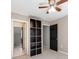 Bedroom featuring neutral walls, a ceiling fan, and two entryways offering versatile access at 3911 Granite St, Terrell, NC 28682
