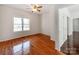 Bedroom with hardwood floors and large windows offers ample natural light at 3911 Granite St, Terrell, NC 28682