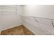 Walk-in closet featuring white metal shelving and neutral carpeting at 3911 Granite St, Terrell, NC 28682