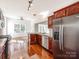Bright kitchen with wood cabinets, stainless appliances, and hardwood floors at 3911 Granite St, Terrell, NC 28682