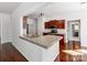 Open kitchen features wood cabinets, stainless appliances, and an eat-in island at 3911 Granite St, Terrell, NC 28682