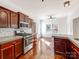 Kitchen with wood cabinets and stainless appliances offers an eat-in area at 3911 Granite St, Terrell, NC 28682