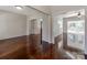 Bright living room with hardwood floors, featuring open access to the kitchen and a view of the patio at 3911 Granite St, Terrell, NC 28682