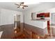 Open-concept living room with hardwood floors, featuring a view of the kitchen and ample natural light at 3911 Granite St, Terrell, NC 28682