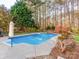 Beautiful backyard pool area featuring fountains and mature trees creating a serene, private setting at 3911 Granite St, Terrell, NC 28682
