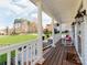 Inviting front porch with rocking chairs, offering a relaxing outdoor space and scenic views of the front yard at 3911 Granite St, Terrell, NC 28682