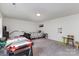 Spacious bedroom features an air hockey table and simple decor at 4630 Bent Green Ln, Monroe, NC 28112