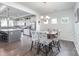 Dining area connecting to a kitchen with modern cabinets and stainless steel appliances at 4630 Bent Green Ln, Monroe, NC 28112