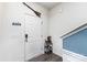 Entryway with a white door, shoe rack, and a blue-trimmed wall, offering a practical and welcoming space at 4630 Bent Green Ln, Monroe, NC 28112