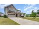 Two-story home with a front-facing two-car garage and a covered porch area surrounded by a lush lawn at 4630 Bent Green Ln, Monroe, NC 28112