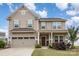 Charming two-story home featuring a two-car garage, covered entry, and well-maintained landscaping at 4630 Bent Green Ln, Monroe, NC 28112
