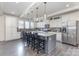 Spacious kitchen featuring a large island, granite countertops, and stainless steel appliances at 4630 Bent Green Ln, Monroe, NC 28112