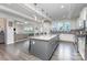 Kitchen with large island, pendant lights, and open to living space at 4630 Bent Green Ln, Monroe, NC 28112