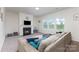 Bright living room with a fireplace, large windows, and a comfy sectional sofa, ideal for relaxation at 4630 Bent Green Ln, Monroe, NC 28112