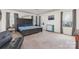 Spacious main bedroom featuring large windows, tray ceilings, and neutral decor at 4630 Bent Green Ln, Monroe, NC 28112