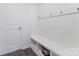 Clean mud room with coat hooks, bead board, and a built-in bench with storage at 4630 Bent Green Ln, Monroe, NC 28112