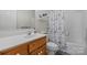 Bathroom with a vanity, commode, and a shower/tub combination with a stylish black and white shower curtain at 4875 Sulpher Springs Ne Rd, Hickory, NC 28601