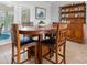 Cozy dining area with a wooden table, chairs, and ample natural light streaming through glass doors at 4875 Sulpher Springs Ne Rd, Hickory, NC 28601