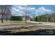 Charming exterior of a home with a long driveway, lush lawn and inviting curb appeal at 4875 Sulpher Springs Ne Rd, Hickory, NC 28601
