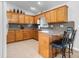 Charming kitchen featuring oak cabinets, light countertops, and a cozy breakfast bar area at 4875 Sulpher Springs Ne Rd, Hickory, NC 28601