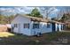 Exterior view of a versatile outbuilding with multiple access points and potential for various uses at 4875 Sulpher Springs Ne Rd, Hickory, NC 28601