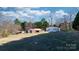 A spacious property featuring multiple outbuildings, including barns and workshops, surrounded by lush greenery at 4875 Sulpher Springs Ne Rd, Hickory, NC 28601