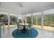 Inviting sunroom with large windows and a circular rug creating a relaxing atmosphere at 4875 Sulpher Springs Ne Rd, Hickory, NC 28601