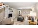 Cozy basement living area with a white brick fireplace and comfortable seating at 500 Lansdowne Rd, Charlotte, NC 28270