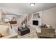 Finished basement with carpet flooring, white brick fireplace, and comfortable furniture at 500 Lansdowne Rd, Charlotte, NC 28270