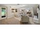 Basement living area featuring carpet flooring, natural light and comfortable seating arrangement at 500 Lansdowne Rd, Charlotte, NC 28270