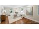 Comfortable bedroom with hardwood floors, neutral decor, and ample natural light from the windows at 500 Lansdowne Rd, Charlotte, NC 28270
