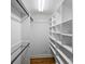 Spacious walk-in closet with custom shelving and hanging rods, maximizing storage potential at 500 Lansdowne Rd, Charlotte, NC 28270