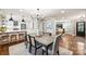 Chic dining area with hardwood floors, stylish lighting, and an open concept design at 500 Lansdowne Rd, Charlotte, NC 28270