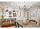 Stylish dining area with a view of the modern kitchen featuring a breakfast bar at 500 Lansdowne Rd, Charlotte, NC 28270