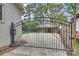 Automated iron gate to driveway for added security and privacy at 500 Lansdowne Rd, Charlotte, NC 28270