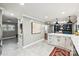 Open-concept kitchen boasts an island, built-in shelving, and seamless flow to the dining area at 500 Lansdowne Rd, Charlotte, NC 28270