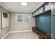 Mudroom with built-in storage, bench, and hooks, perfect for organization and convenience at 500 Lansdowne Rd, Charlotte, NC 28270