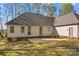 Backyard view of home featuring large patio and green grass at 620 St Lukes Church Rd, Salisbury, NC 28146