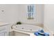 Soaking tub with a view of the property from the framed window above the tub at 620 St Lukes Church Rd, Salisbury, NC 28146