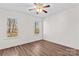 Bedroom featuring hardwood flooring and two bright windows at 620 St Lukes Church Rd, Salisbury, NC 28146