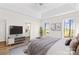 Staged primary bedroom featuring an ensuite bath and windows with beautiful views of the property at 620 St Lukes Church Rd, Salisbury, NC 28146