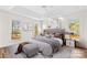 Staged primary bedroom showcasing a tray ceiling, large windows, and stylish decor for a luxurious feel at 620 St Lukes Church Rd, Salisbury, NC 28146