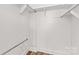 Walk-in closet featuring white walls, shelving, and hardwood floors at 620 St Lukes Church Rd, Salisbury, NC 28146