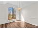 Empty dining room features a stylish light fixture and a bright view window at 620 St Lukes Church Rd, Salisbury, NC 28146