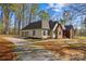 Well-maintained home with a three-car garage, brick accents, and a gravel driveway at 620 St Lukes Church Rd, Salisbury, NC 28146